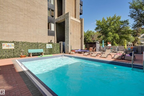 View of pool with patio surround - 1502 10160 115 Street, Edmonton, AB - Outdoor With In Ground Pool