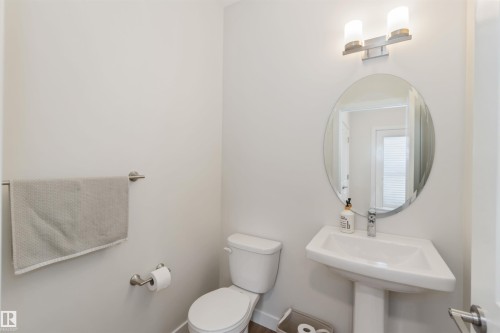 Half bathroom with toilet and baseboards - 72 Penn Place, Spruce Grove, AB - Indoor Photo Showing Bathroom