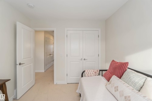 Sitting room featuring light carpet and baseboards - 72 Penn Place, Spruce Grove, AB - Indoor