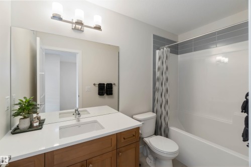 Full bathroom with shower / bath combo with shower curtain and vanity - 72 Penn Place, Spruce Grove, AB - Indoor Photo Showing Bathroom