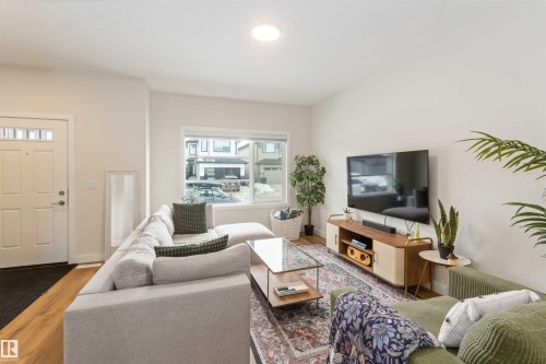 Living area featuring wood finished floors - 72 Penn Place, Spruce Grove, AB - Indoor Photo Showing Living Room