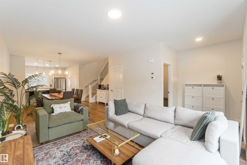Living area with wood finished floors and recessed lighting - 72 Penn Place, Spruce Grove, AB - Indoor Photo Showing Living Room