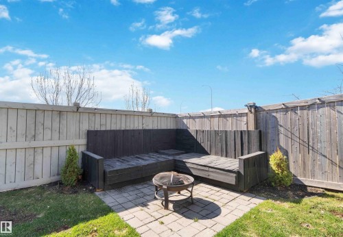 Fenced backyard featuring a patio and a fire pit - 1965 118 Street, Edmonton, AB - Outdoor