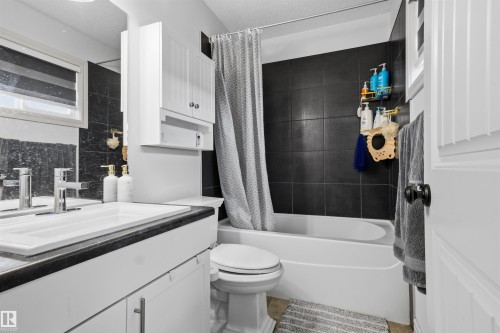 Bathroom with vanity and shower / tub combo - 1965 118 Street, Edmonton, AB - Indoor Photo Showing Bathroom