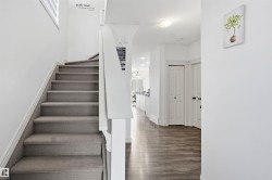 Stairs featuring baseboards and wood finished floors - 
