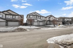 View of front of house featuring a residential view and an attached garage - 