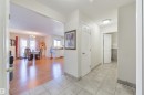 Hall with light tile patterned floors, suspended lighting, and a textured ceiling - 11522 128 Street, Edmonton, AB  - Indoor Photo Showing Other Room 