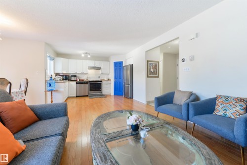 Living area featuring light wood-type flooring - 11522 128 Street, Edmonton, AB - Indoor Photo Showing Living Room