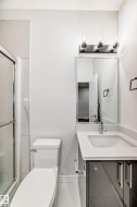 Bathroom featuring vanity and a stall shower - 