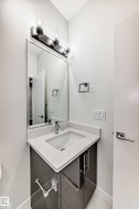 Bathroom featuring vanity and baseboards - 