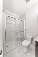 Full bath featuring a stall shower and vanity - 
