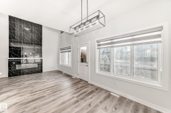 Unfurnished dining area featuring light wood-style floors and baseboards - 