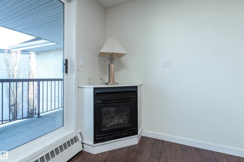 458 10520 120 Street, Edmonton, AB - Indoor With Fireplace