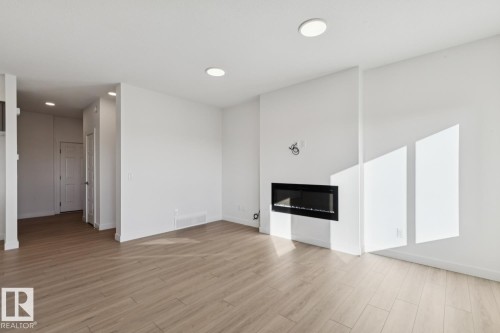 41 Sumac Close, Fort Saskatchewan, AB - Indoor Photo Showing Living Room With Fireplace