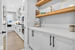 Walk through pantry with loads of storage - 