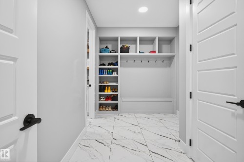 HUGE mudroom...perfect for the whole family - 3912 Ginsburg Crescent, Edmonton, AB - Indoor Photo Showing Other Room
