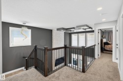 Soaring living room ceilings radiate with natural light to the 2nd floor - 