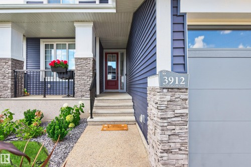 Warm and inviting entrance with front covered porch - 3912 Ginsburg Crescent, Edmonton, AB - Outdoor