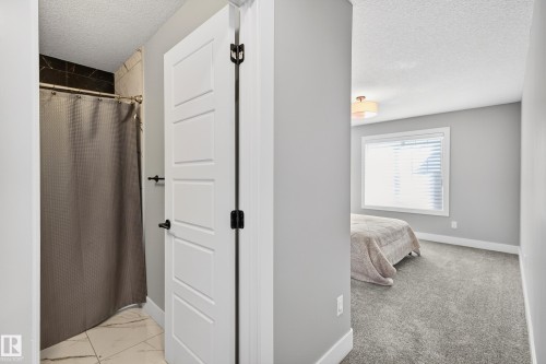 Bedroom #2 on second floor has its own full ensuite bath - 3912 Ginsburg Crescent, Edmonton, AB - Indoor