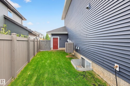 Man door from garage to back yard - 3912 Ginsburg Crescent, Edmonton, AB - Outdoor With Exterior