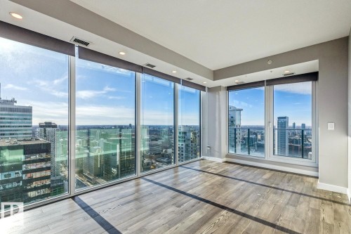 Unfurnished room with a view of city, floor to ceiling windows, light wood-style flooring, and recessed lighting - 3300 10180 103 Street, Edmonton, AB - Indoor Photo Showing Other Room