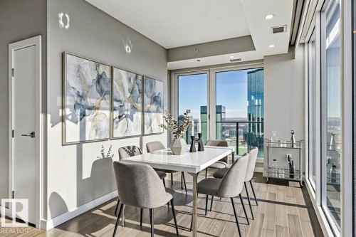 Dining room with light wood-style floors, plenty of natural light, and recessed lighting - 3300 10180 103 Street, Edmonton, AB - Indoor Photo Showing Dining Room