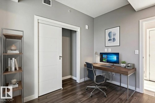 Office space featuring baseboards and dark wood finished floors - 3300 10180 103 Street, Edmonton, AB - Indoor Photo Showing Office