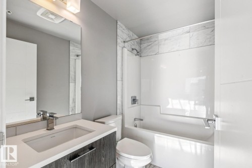 Bathroom featuring shower / washtub combination and vanity - 3300 10180 103 Street, Edmonton, AB - Indoor Photo Showing Bathroom