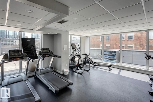 Exercise room with a drop ceiling - 3300 10180 103 Street, Edmonton, AB - Indoor Photo Showing Gym Room