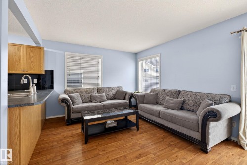 108 150 Edwards Drive, Edmonton, AB - Indoor Photo Showing Living Room