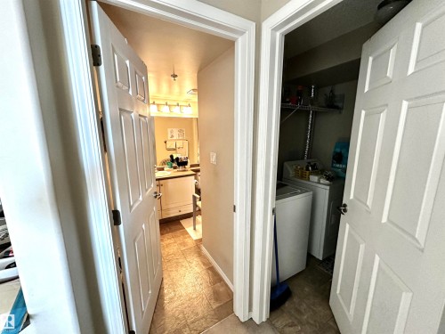 Laundry area with washing machine and dryer - 215 13625 34 Street, Edmonton, AB - Indoor Photo Showing Other Room