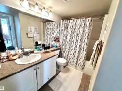 Bathroom with shower / bath combo and vanity - 