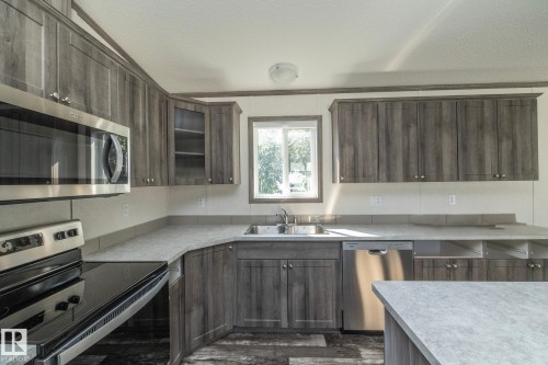 74 Willow Park Estates, Leduc, AB - Indoor Photo Showing Kitchen With Double Sink