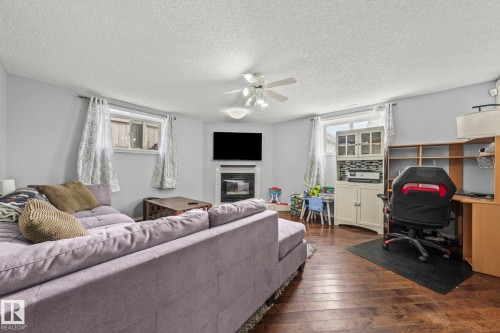 13859 131A Avenue, Edmonton, AB - Indoor Photo Showing Living Room With Fireplace