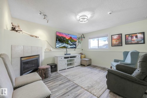 24 2419 133 Avenue, Edmonton, AB - Indoor Photo Showing Living Room With Fireplace