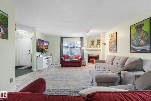 24 2419 133 Avenue, Edmonton, AB - Indoor Photo Showing Living Room With Fireplace