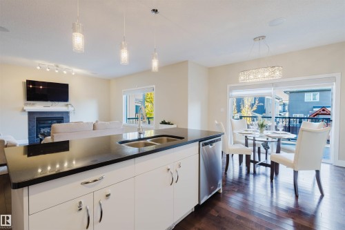 2122 Ware Road, Edmonton, AB - Indoor Photo Showing Kitchen With Fireplace With Double Sink