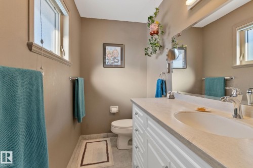 Bathroom with vanity and healthy amount of natural light - 4231 39 Avenue, Leduc, AB - Indoor Photo Showing Bathroom