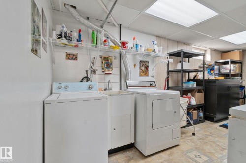 Laundry room featuring a paneled ceiling and washer and clothes dryer - 4231 39 Avenue, Leduc, AB - Indoor Photo Showing Laundry Room