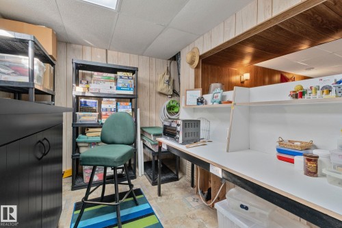 Home office with a drop ceiling and wood walls - 4231 39 Avenue, Leduc, AB - Indoor