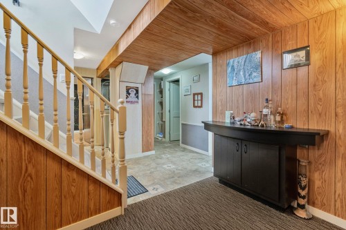 Indoor dry bar featuring wood walls and wood ceiling - 4231 39 Avenue, Leduc, AB - Indoor Photo Showing Other Room