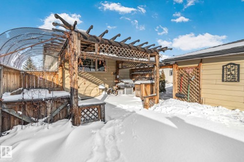 Snow covered patio with a pergola - 4231 39 Avenue, Leduc, AB - Outdoor
