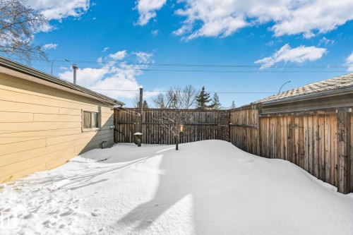 Snowy yard with a fenced backyard - 4231 39 Avenue, Leduc, AB - Outdoor