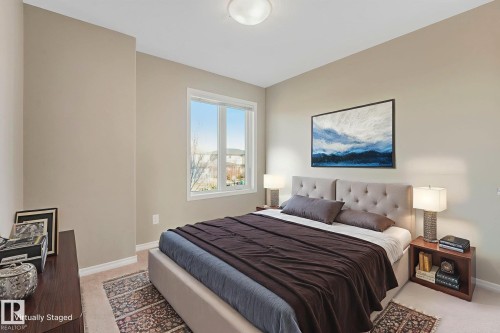 Virtually Furnished Bedroom 2  with baseboards and light colored carpet - 385 Secord Boulevard, Edmonton, AB - Indoor Photo Showing Bedroom