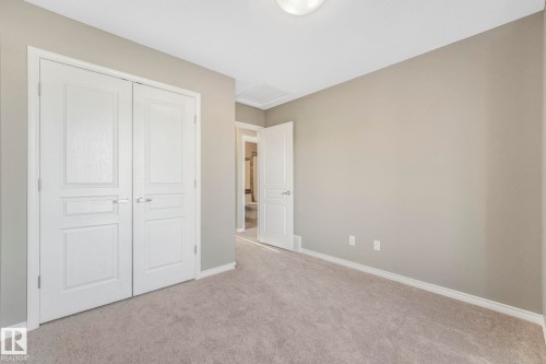 Unfurnished bedroom featuring light colored carpet and a closet - 385 Secord Boulevard, Edmonton, AB - Indoor Photo Showing Other Room