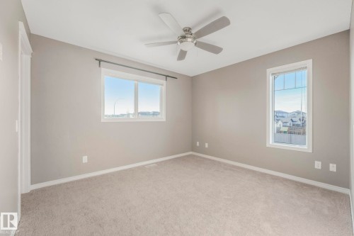 Master Bedroom featuring light carpet and a ceiling fan - 385 Secord Boulevard, Edmonton, AB - Indoor Photo Showing Other Room