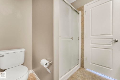 Full bathroom featuring a stall shower and light tile patterned floors - 385 Secord Boulevard, Edmonton, AB - Indoor Photo Showing Bathroom
