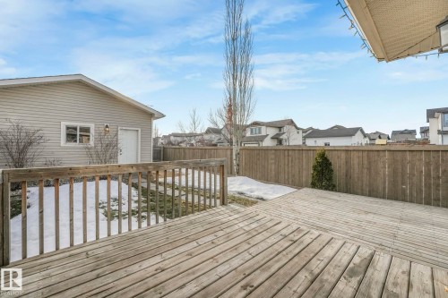 Deck with a residential view and a fenced backyard - 385 Secord Boulevard, Edmonton, AB - Outdoor With Deck Patio Veranda With Exterior