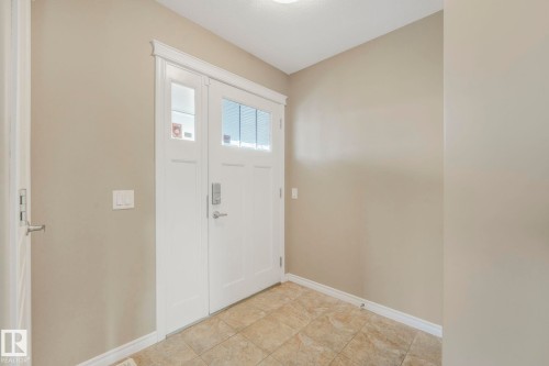 Foyer with baseboards - 385 Secord Boulevard, Edmonton, AB - Indoor Photo Showing Other Room