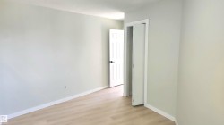 Spare room with light wood-style floors and baseboards - 
